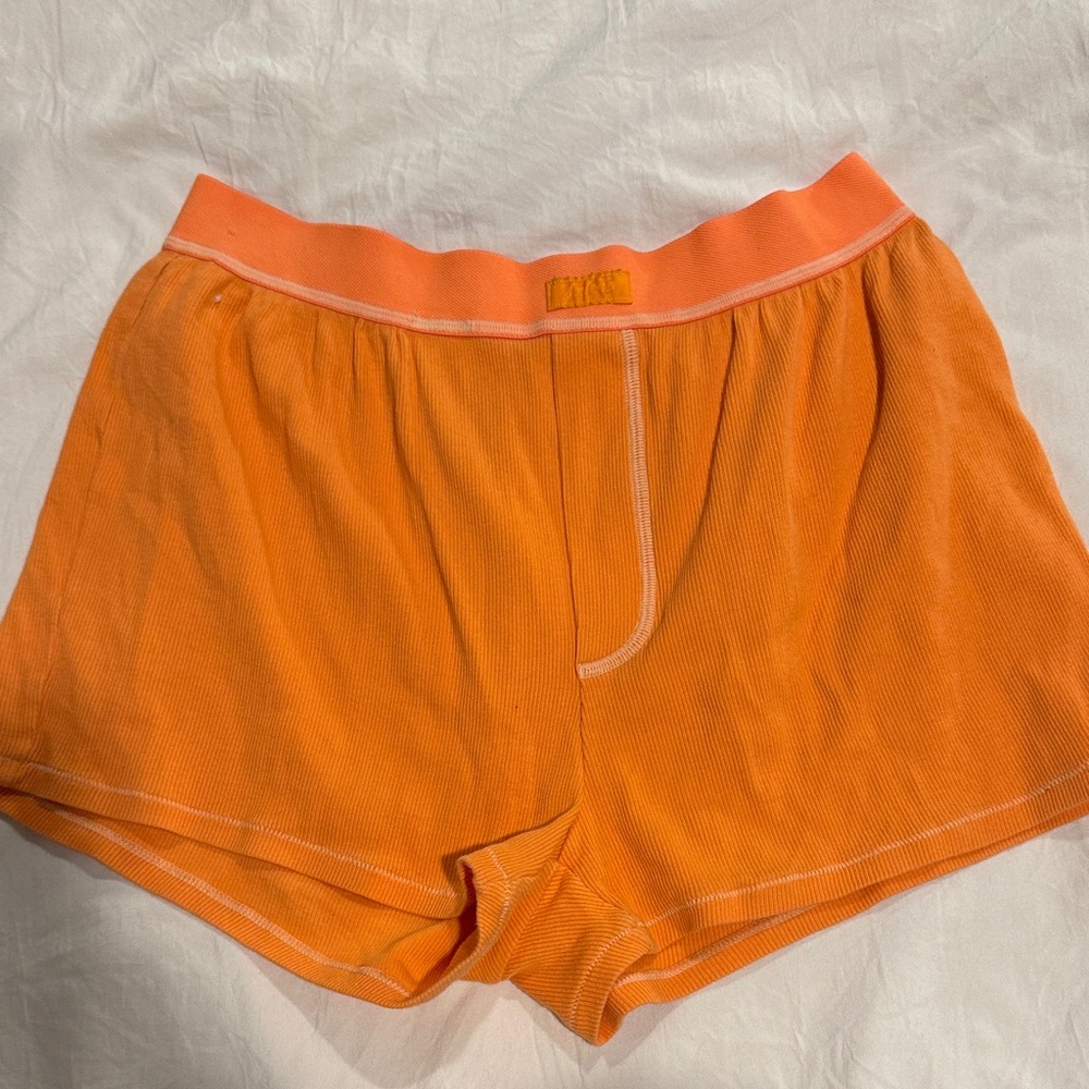 Skims orange sleep shorts. Size small.